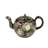 A Staffordshire globular creamware teapot and cover, mid 18th century, with crabstock handle and