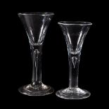 Two plain-stemmed wine glasses of drawn trumpet form, circa 1740, each with a tear inclusion and a