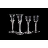 Three various eighteen century drinking glasses, comprising: two various opaque-twist wine