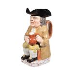 A Neale & Co. pearlware Toby jug, circa 1790, painted in shades of brown and ochre and on a