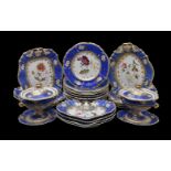 An English porcelain 'Rococo revival' blue-ground part dessert service painted with flowers, circa