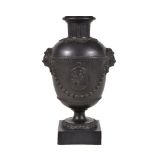 A Humphrey Palmer black basalt vase, circa 1775, the domed shoulder with dentil border suspending