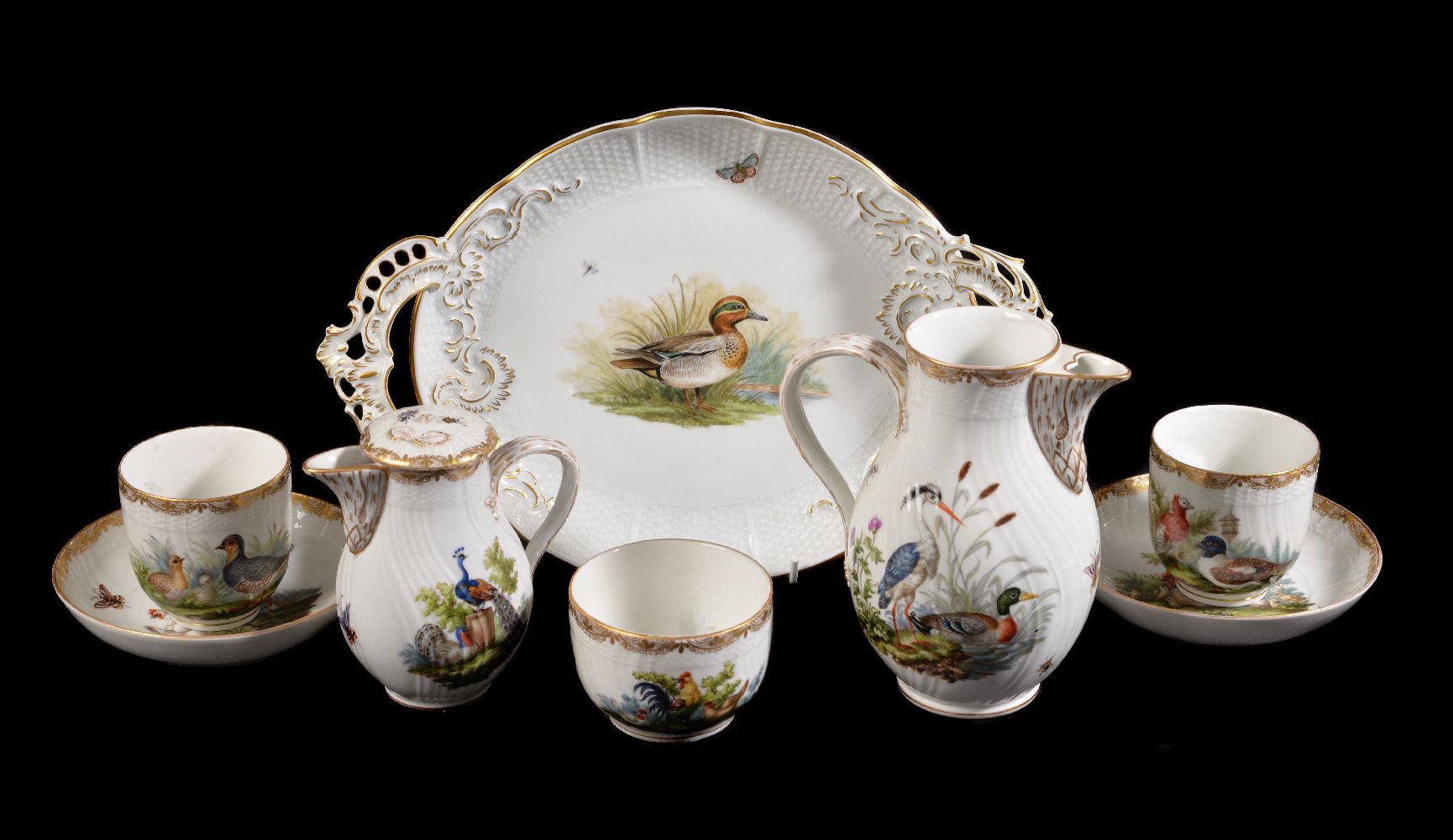 A selection of Berlin porcelain painted with domestic fowl, late 19th century, comprising: a pair of