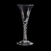 A mercury-twist wine glass, mid 18th century, of drawn trumpet form and supported on a stem with a