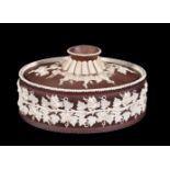 A Turner white stoneware and brown slip decorated pie dish and cover, circa 1800, sprigged in relief