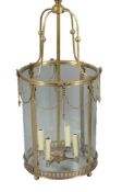 A brass and glazed four light hall lantern