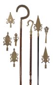 Three various Friendly Society brasses mounted on turned and stained wood poles