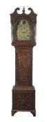 A carved oak longcase clock