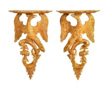 A pair of carved and gilded wall brackets in 18th century style