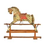 A painted wood and composition rocking horse