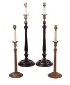 A pair of brass mounted stained mahogany table lamps modelled as George III style candlesticks