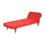 A Victorian walnut and red button upholstered day bed