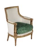 A parcel gilt and painted bergere in Louis XVI style