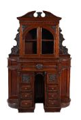 A Victorian carved walnut side cabinet