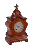 A Continental stained birdseye maple mantel clock