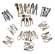 ϒ A collection of 39 various brass and pewter nutcrackers and other culinary implements