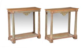 A pair of green painted and parcel gilt console tables in Empire style