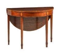 A George III plum mahogany and inlaid side table