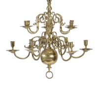 A Dutch or English brass twelve light chandelier