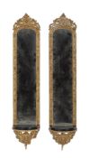A pair of gilt composition framed mirror back wall brackets