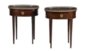 A pair of mahogany oval occasional tables