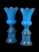 A pair of Continental opaque turquoise and gilt floriform vases and stands in late 19th century styl
