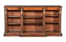 ϒ A rosewood and gilt metal mounted open bookcase in Egyptian Revival taste