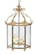 A gilt metal and glazed hexagonal ceiling lantern in Regency taste