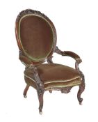 A mid-Victorian carved mahogany and upholstered salon chair