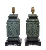 A pair of Archaic style bronzed table lamps