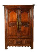 A French carved oak press cupboard