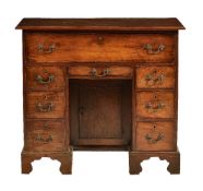 A George II mahogany kneehole desk