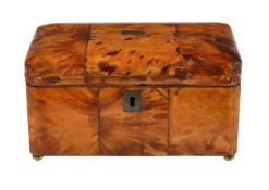 ϒ A George III tortoiseshell veneered tea caddy