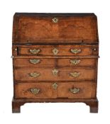 A George I walnut and feather banded bureau