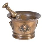 A Continental, probably French, bronze mortar decorated with winged cherubs' masks