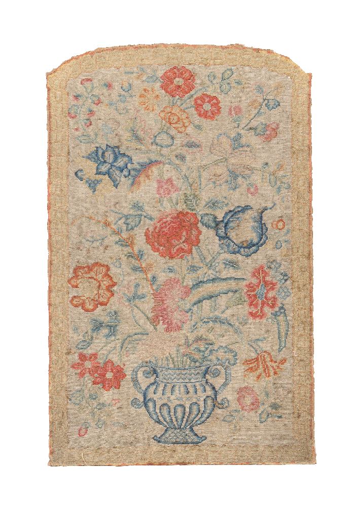 A George II embroidered needlework panel depicting an urn of flowers