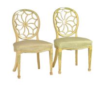A pair of cream painted armchairs in Chinese Chippendale taste