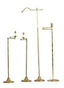 Four various lacquered brass adjustable standard lamps