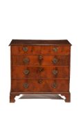 A walnut and pine chest of drawers
