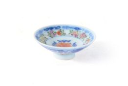 A Chinese blue and white 'Famille Rose' and iron red cover for a bowl, Qianlong