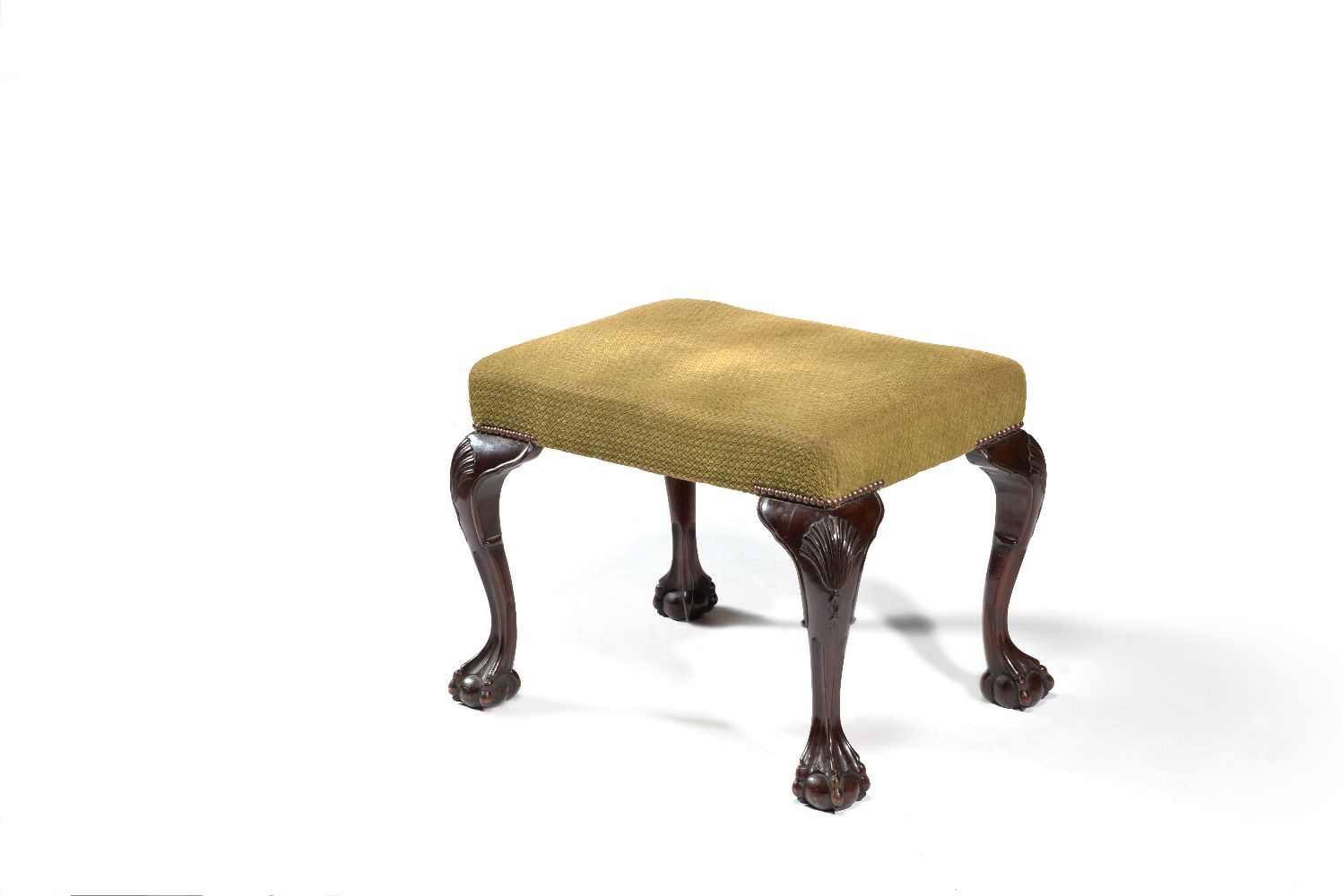 A carved mahogany stool in George III Irish style, late 19th century