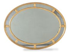 A giltwood and composition oval wall mirror, late 18th/ 19th century