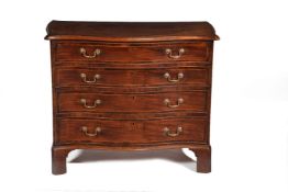 A George III mahogany, crossbanded, and line inlaid chest of drawers, circa 1770