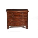 A George III mahogany, crossbanded, and line inlaid chest of drawers, circa 1770