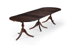 A mahogany triple pedestal dining table in the George III style, 20th century