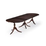 A mahogany triple pedestal dining table in the George III style, 20th century