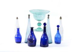 A group of four various blue glass baluster decanters