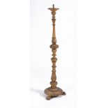 A carved giltwood standard lamp