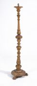 A carved giltwood standard lamp