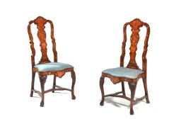 A pair of Dutch walnut and marquetry inlaid side chairs in 18th century style